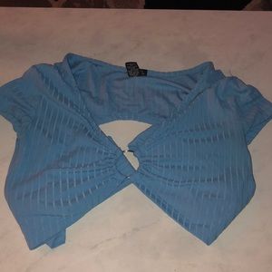 A crop top w/ strings to tie around the back